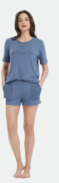 Woman wearing a blue short-sleeve T-shirt and matching shorts