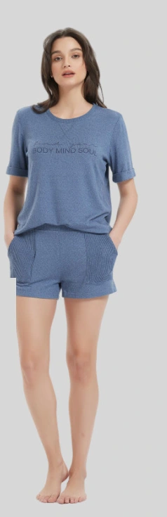 Woman wearing a blue short-sleeve T-shirt and matching shorts