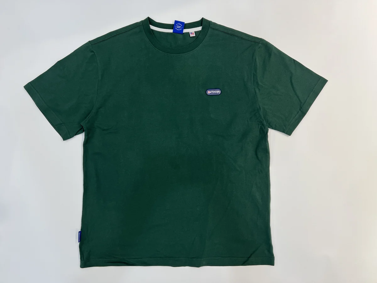 Green short-sleeve crewneck T-shirt laid flat