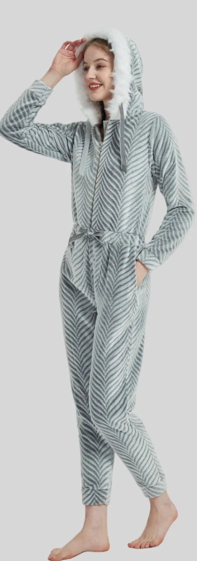Standing adult wearing a leaf-print hooded onesie with long legs