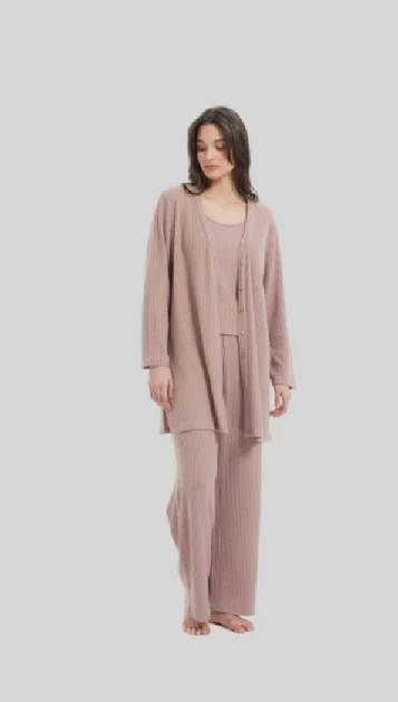 Woman wearing a muted pink open-front layer with matching lounge trousers
