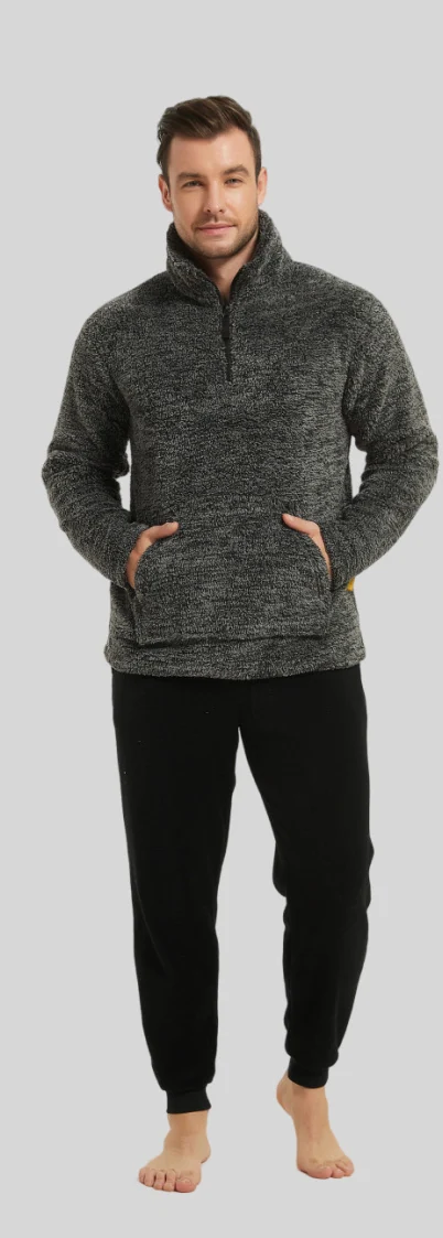 Man wearing a dark grey half-zip top and black lounge trousers